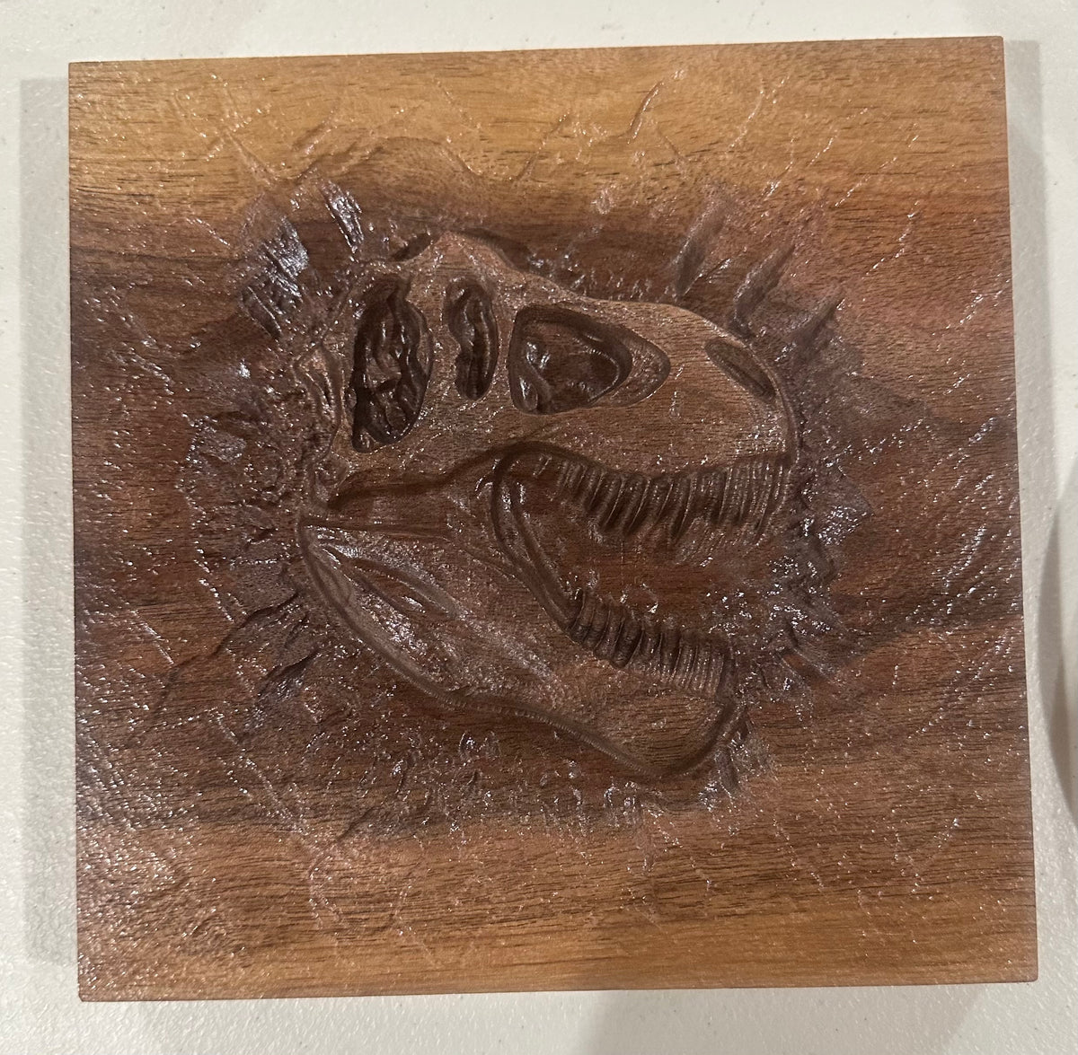 T-Rex Skull Fossil Wood Carving – 7.25" Solid Walnut Dinosaur Wall Art